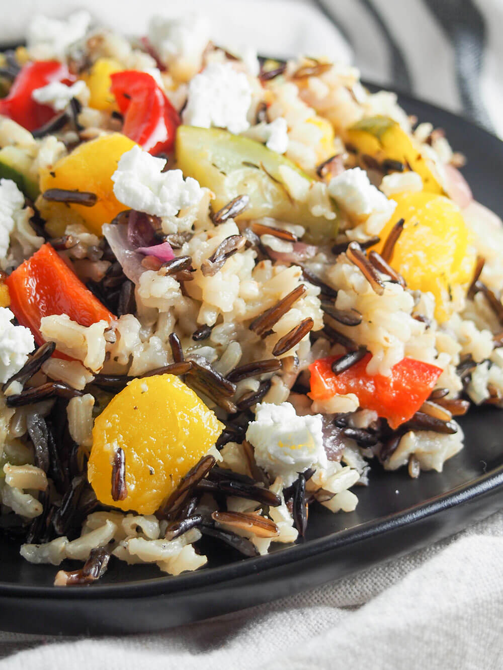 close up view of acorn squash wild rice salad from side
