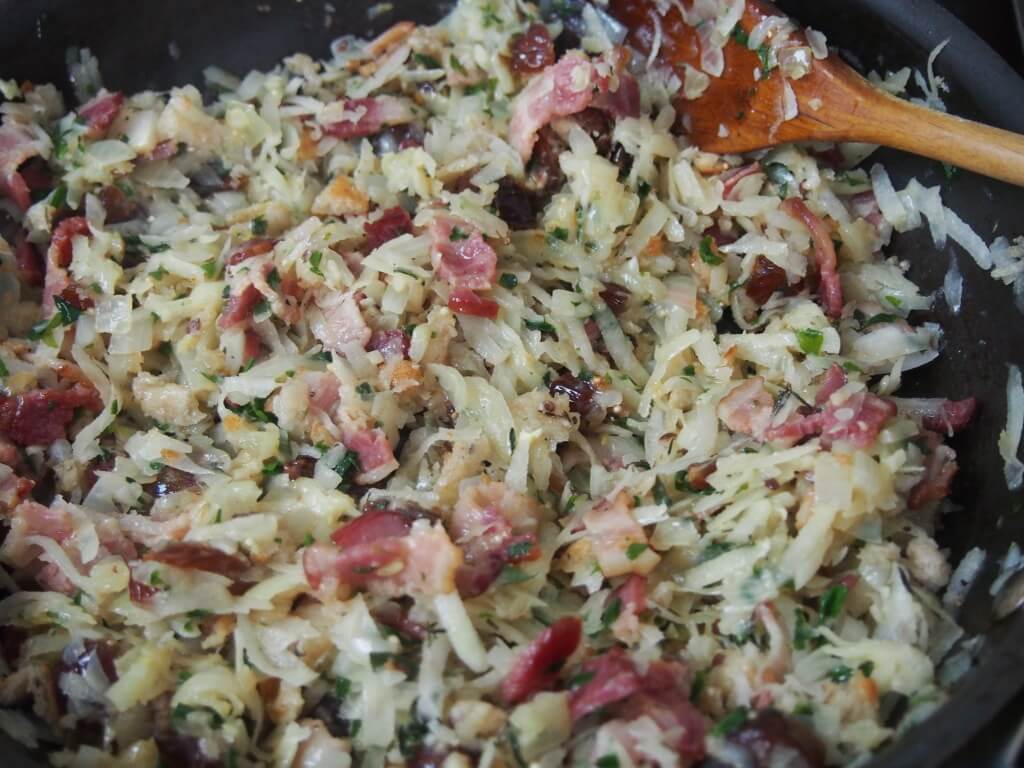 stirring bacon rutabaga mix in skillet