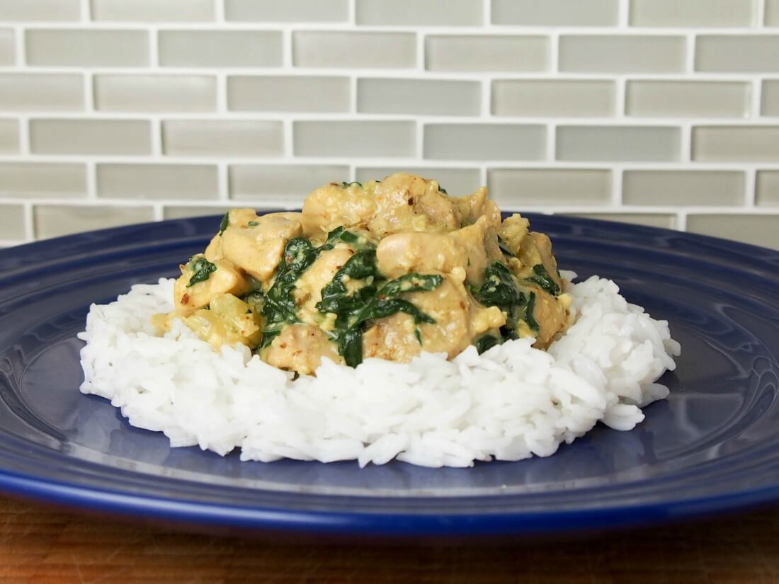 Fragrant chicken curry with chard, coconut and cashew