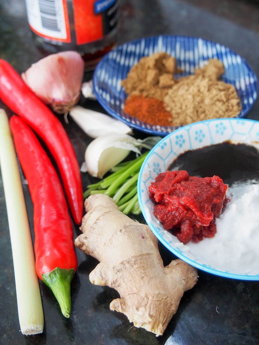 Thai red curry paste ingredients in dishes as well as whole spices