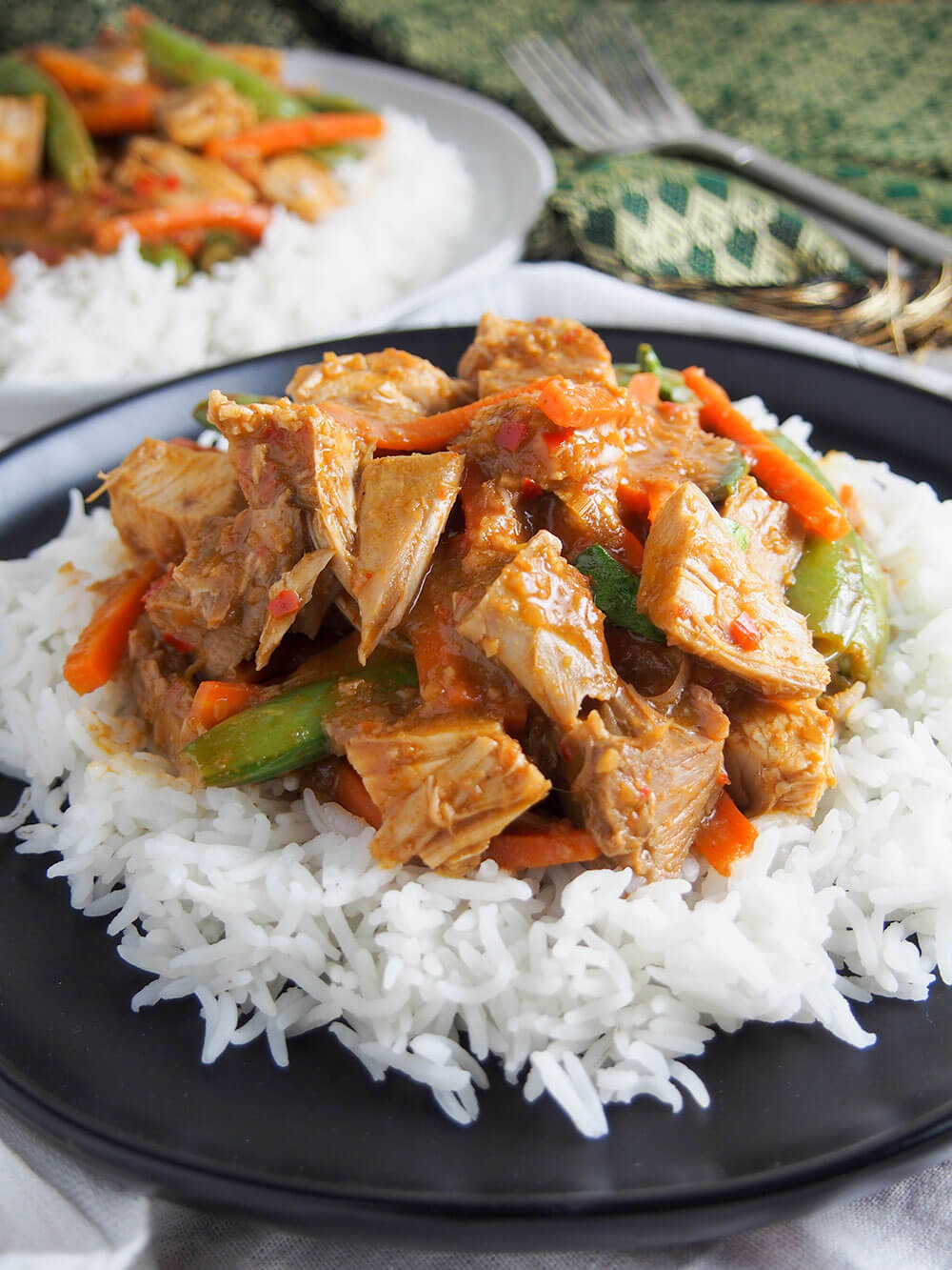 Thai red curry served over rice close up
