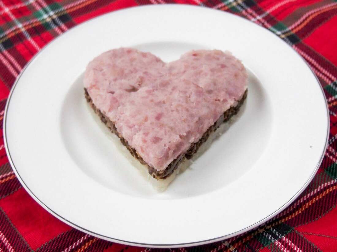 A simplified haggis using pink potatoes and light rutabaga shaped in heart stack
