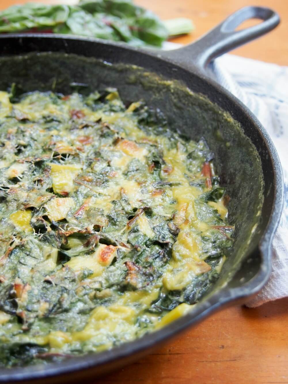 side view of part of dish with leek and Swiss chard gratin