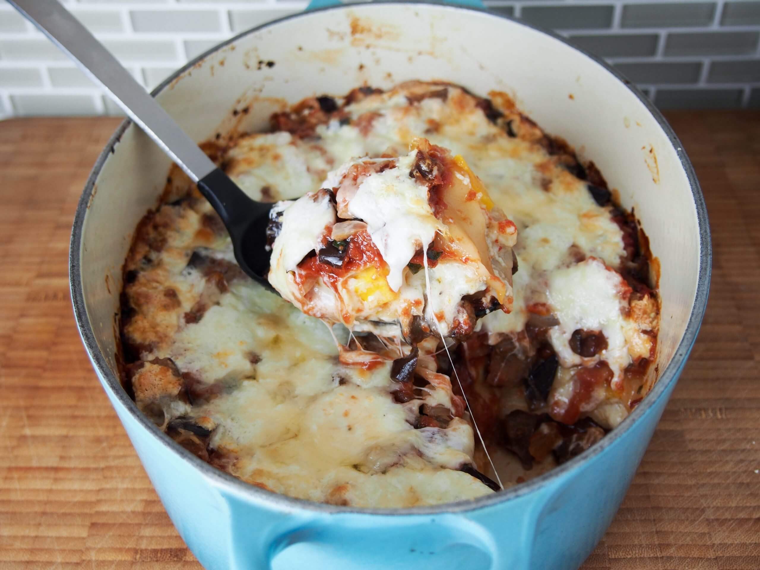 taking spoonful of Squash and eggplant lasagna