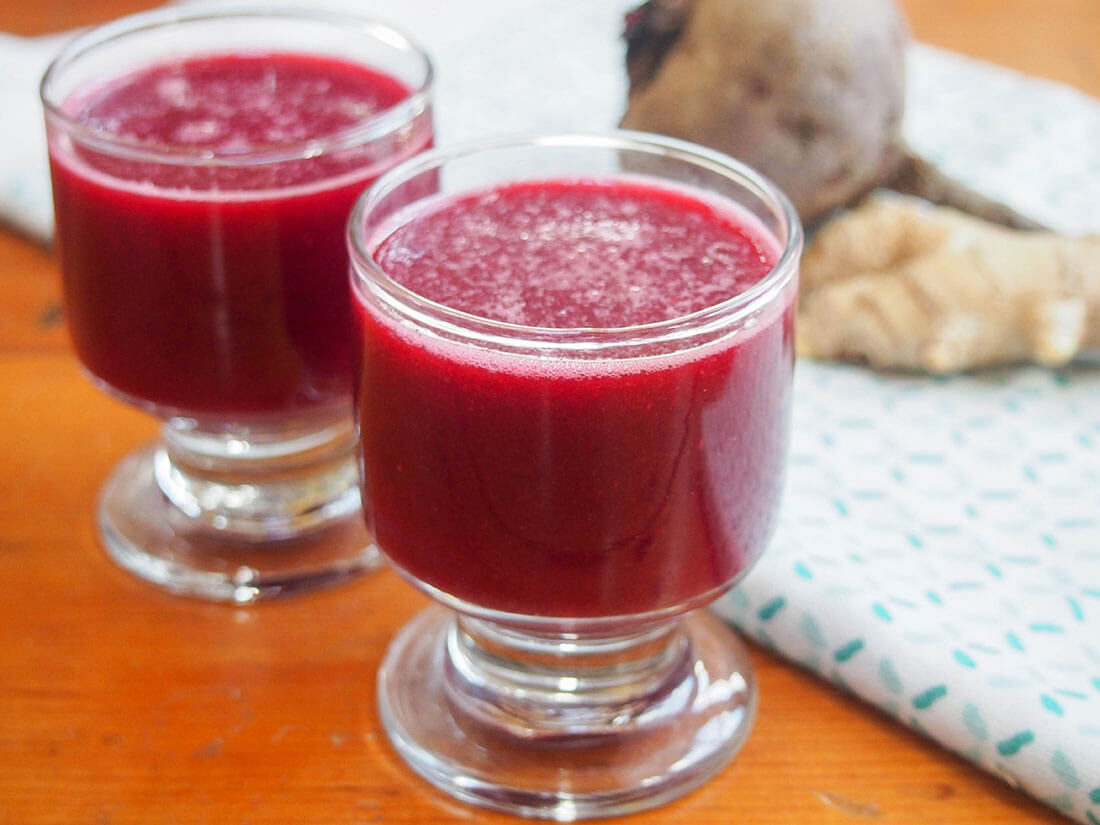 Apple beet ginger juice in two glasses