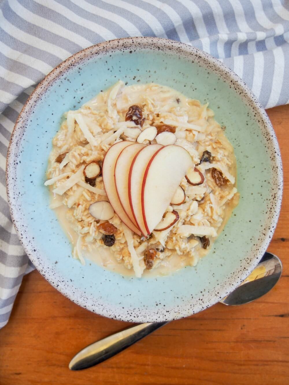 bowl of Swiss Bircher muesli from overhead with spoon under bowl