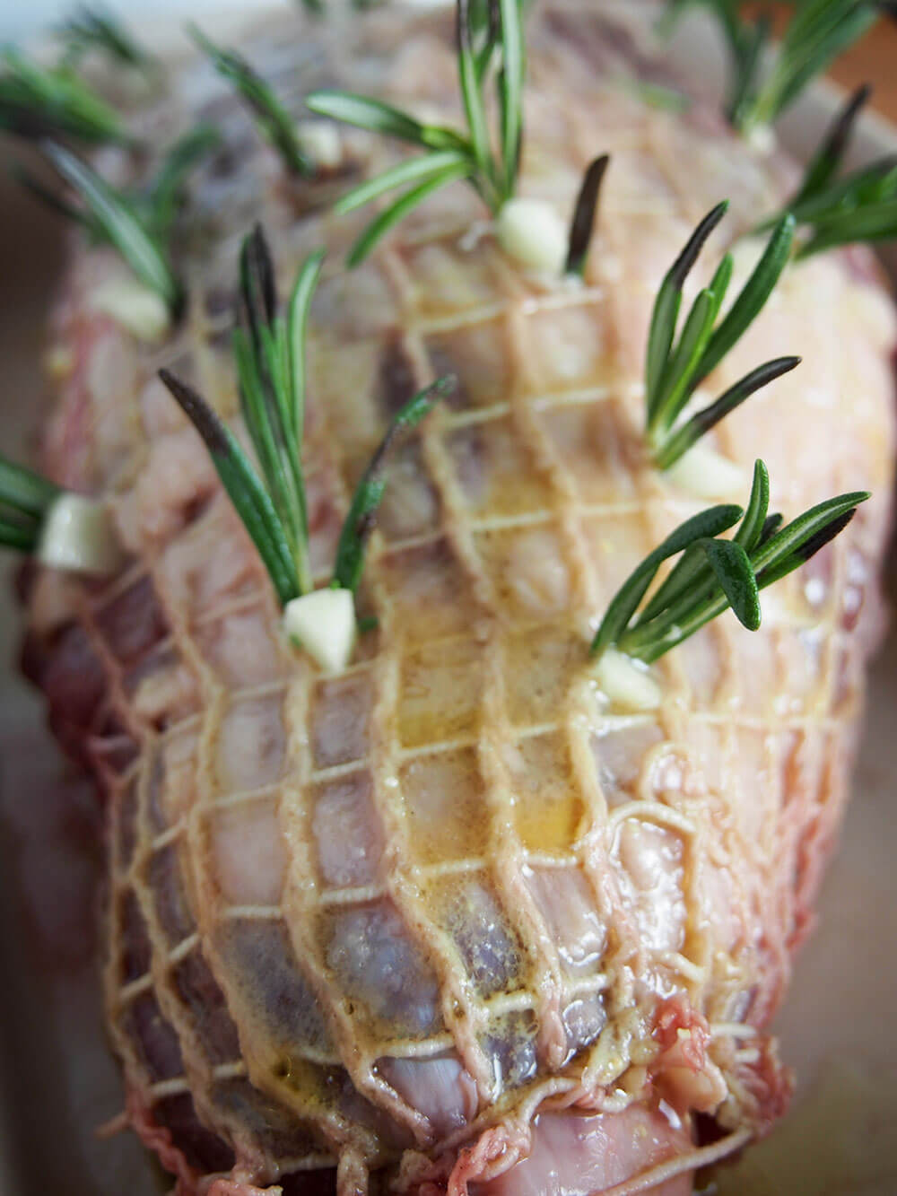 close up of leg of lamb prepared and and ready to roast