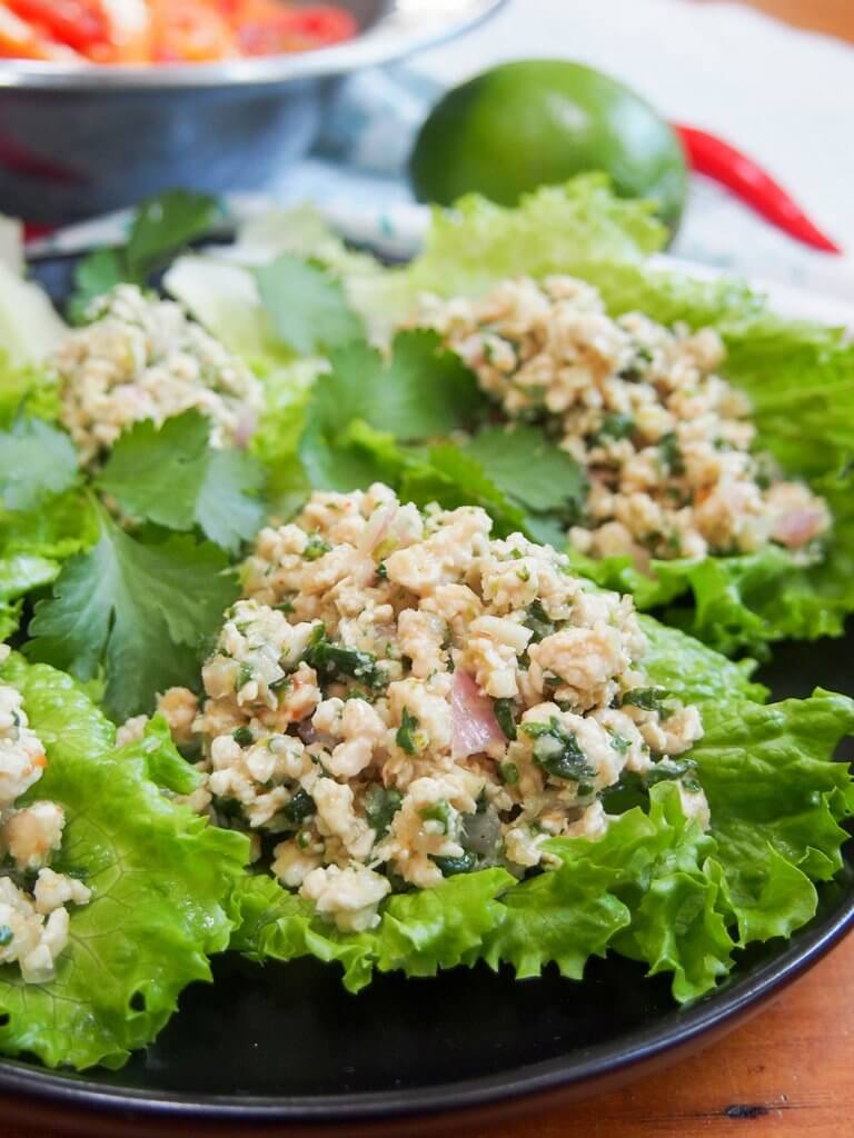 plate of larp (also called larb gai, Thai/Laos chicken salad) on lettuce leaves