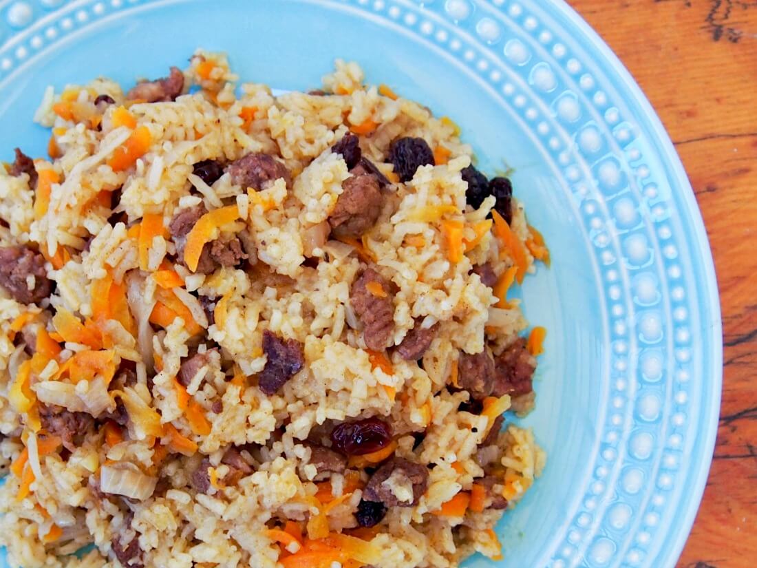 corner of plate of lamb pilaf from above