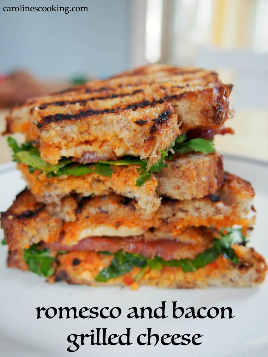 romesco and bacon grilled cheese sandwich: This delicious twist on a bacon grilled cheese sandwich uses piquant romesco sauce along with bacon, smoked cheddar and arugula to create a fantastic lunch. #grilledcheese #sandwich #bacon #romescosauce