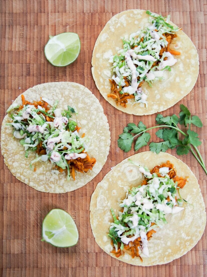 These sweet potato tacos are easy to make & thoroughly delicious. Gently spiced sweet potato, a crunchy, zesty slaw & a kick from chipotle cream. Vegetarian