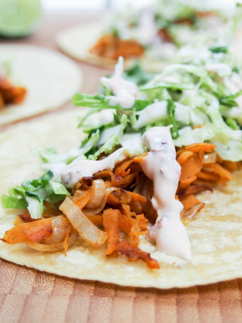 These sweet potato tacos are easy to make & thoroughly delicious. Gently spiced sweet potato, a crunchy, zesty slaw & a kick from chipotle cream. Vegetarian