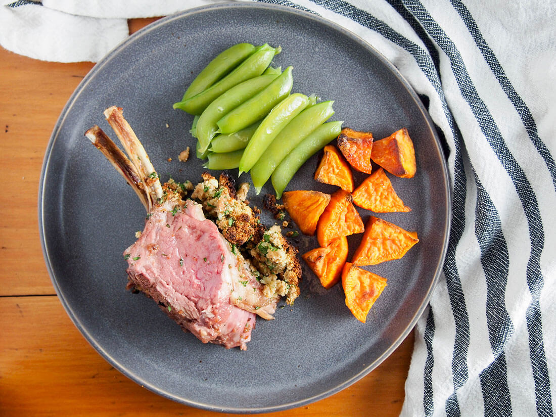 garlic herb crusted rack of lamb with sides