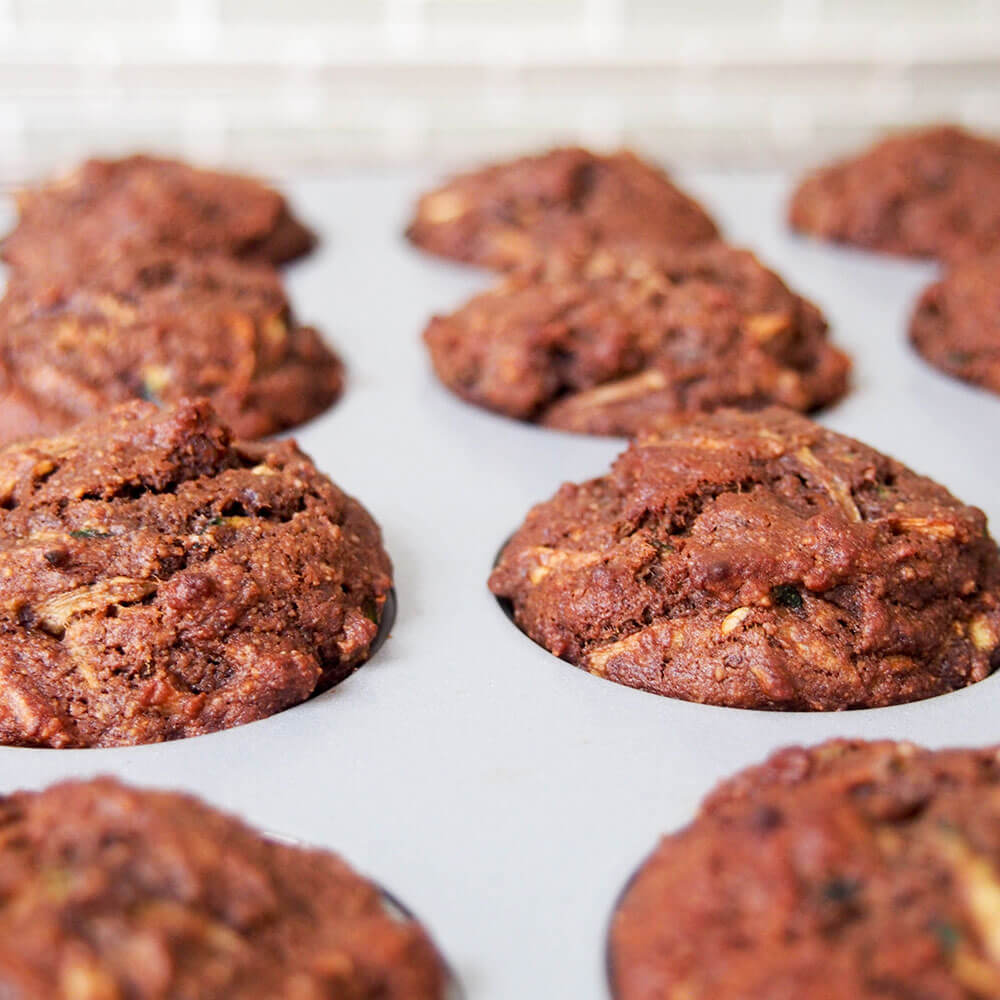 Healthy chocolate zucchini muffins (vegan) in baking tray