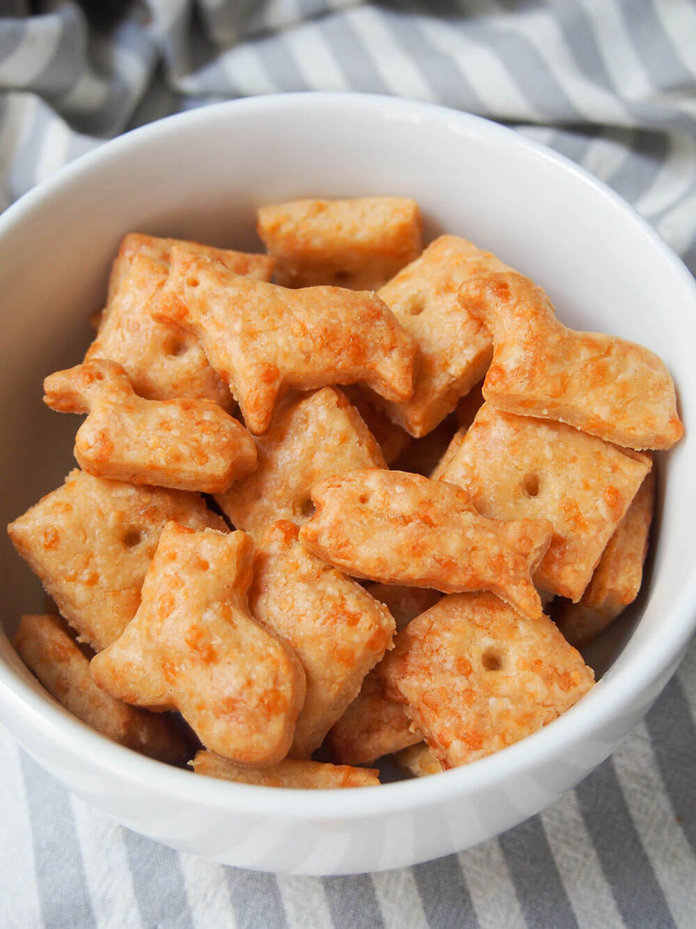 homemade cheese crackers in bowl, close up view