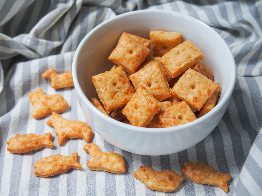 homemade cheese crackers in bowl with animal shapes ones below