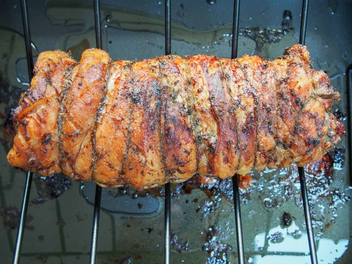 Porchetta on rack in roasting dish