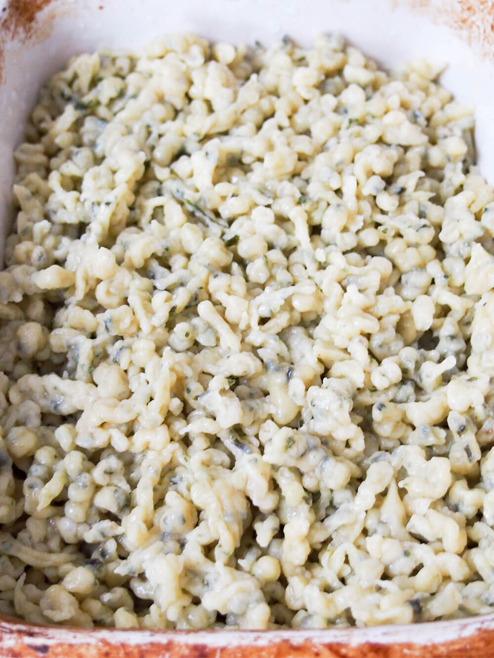 herb spaetzle in dish ready to re-heat herb spaetzle in dish ready to re-heat