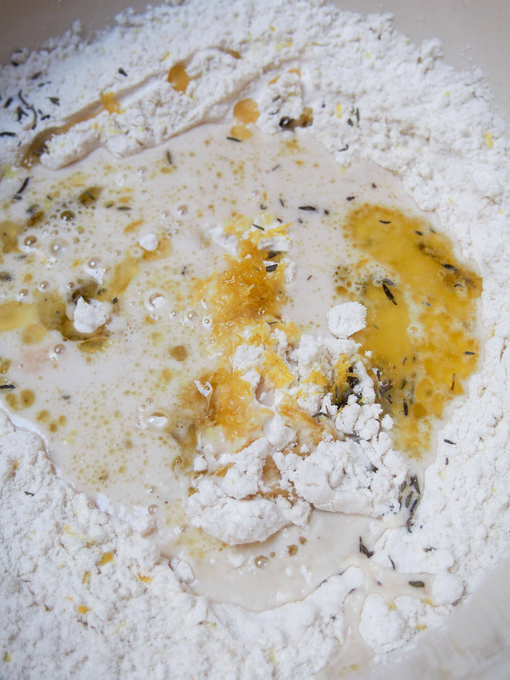 mixung ingredients for lemon thyme focaccia