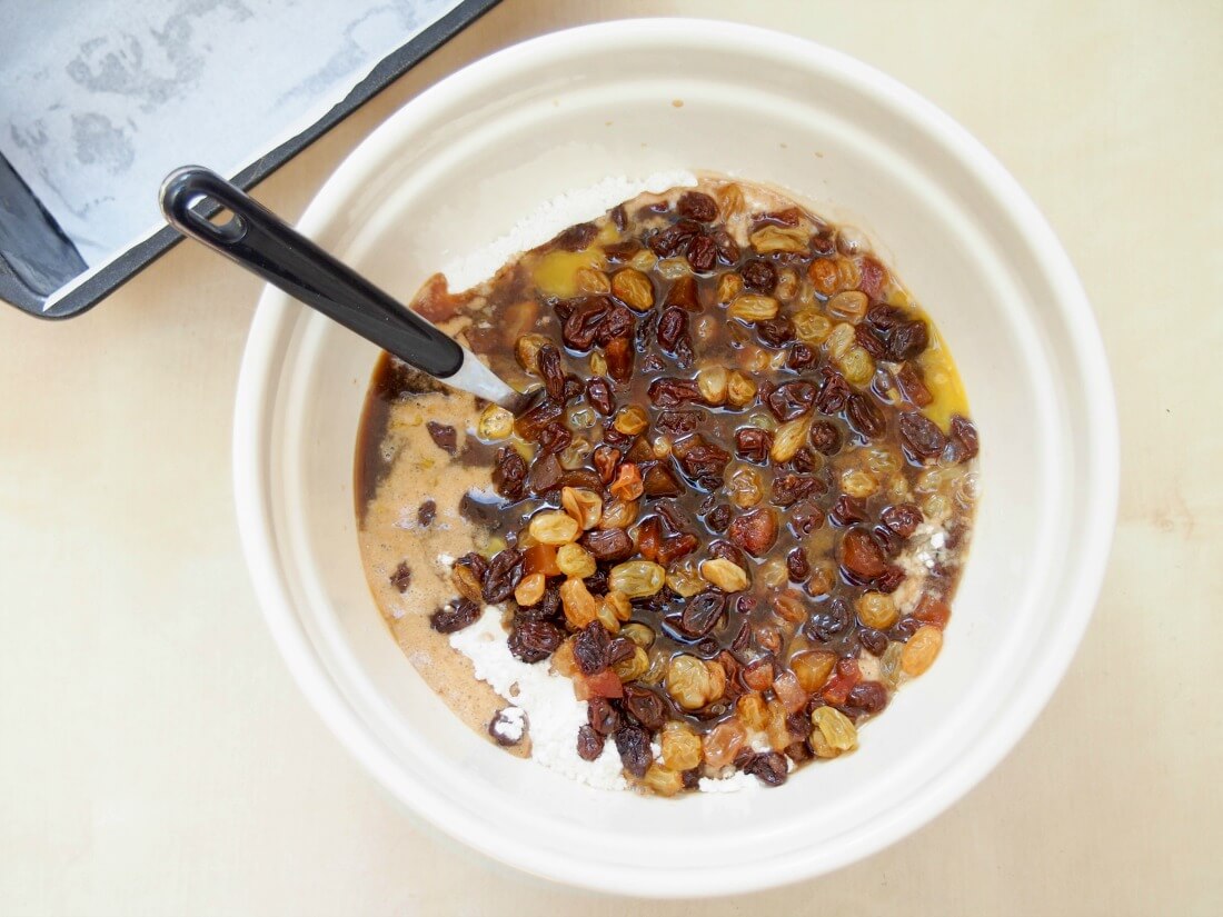 ingredients in bowl for Irish brack before mixing soaked fruit mixture in bowl over flour before mixing