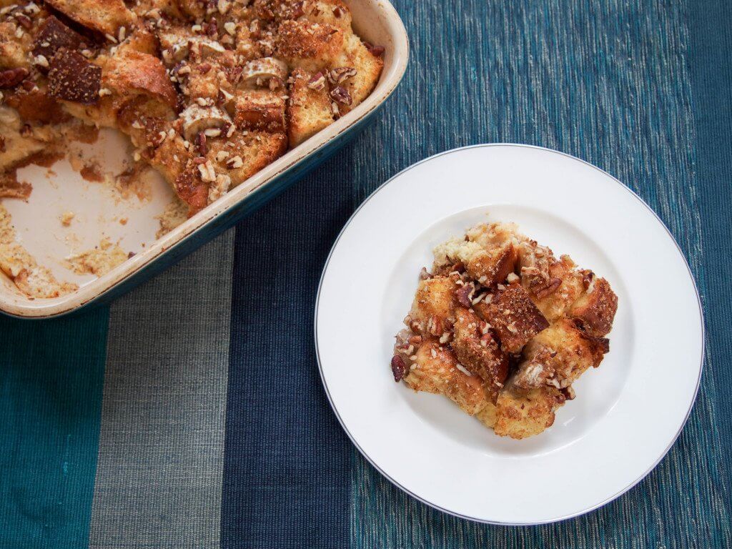 This overnight baked banana French toast is easy to make and delicious with bananas baked in and a touch of brown sugar and pecans crisped on the top.