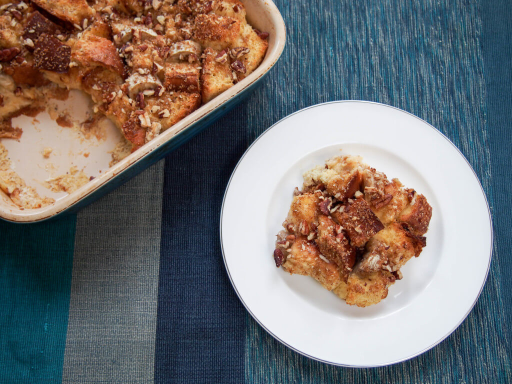 This overnight baked banana French toast is easy to make and delicious with bananas baked in and a touch of brown sugar and pecans crisped on the top.