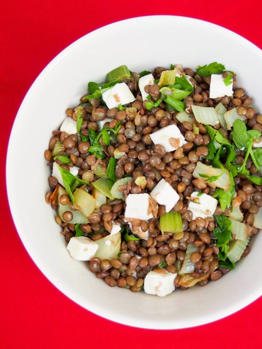 French lentil salad with feta, fennel and celery part view of bowl of French lentil salad with feta, fennel and celery