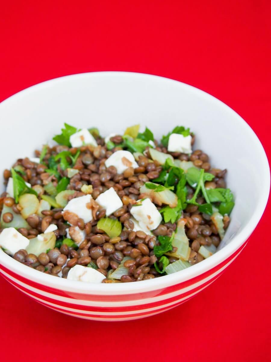French lentil salad with feta, fennel and celery French lentil salad with feta, fennel and celery in bowl from side