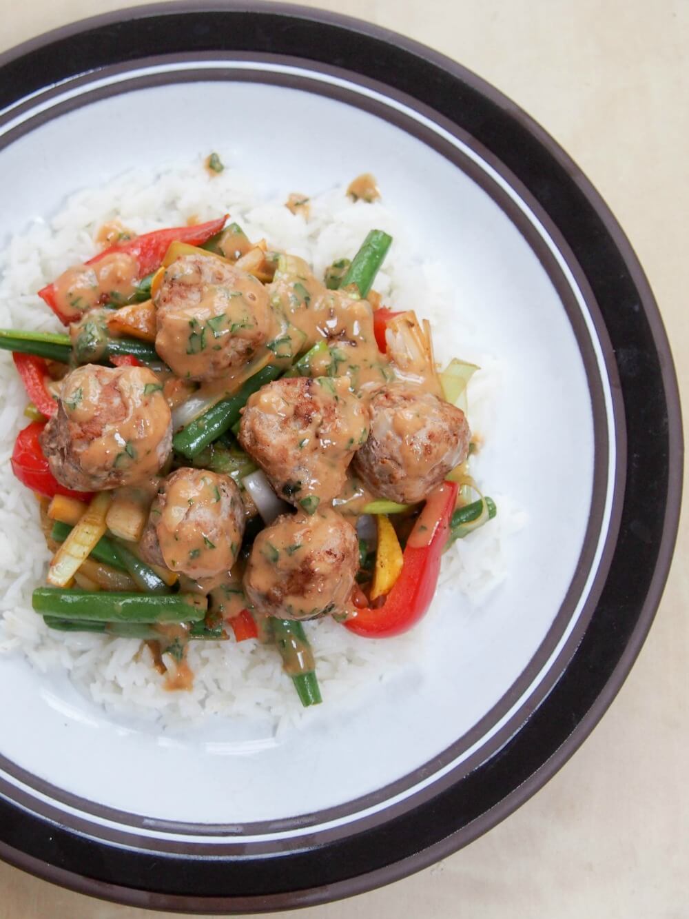 Thai basil pork meatballs with peanut-basil sauce as stir fry