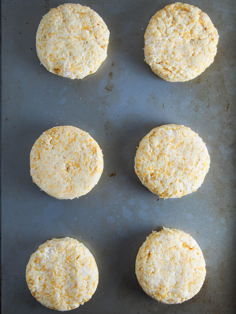 butternut squash biscuits with gruyere on baking sheet ready to bake