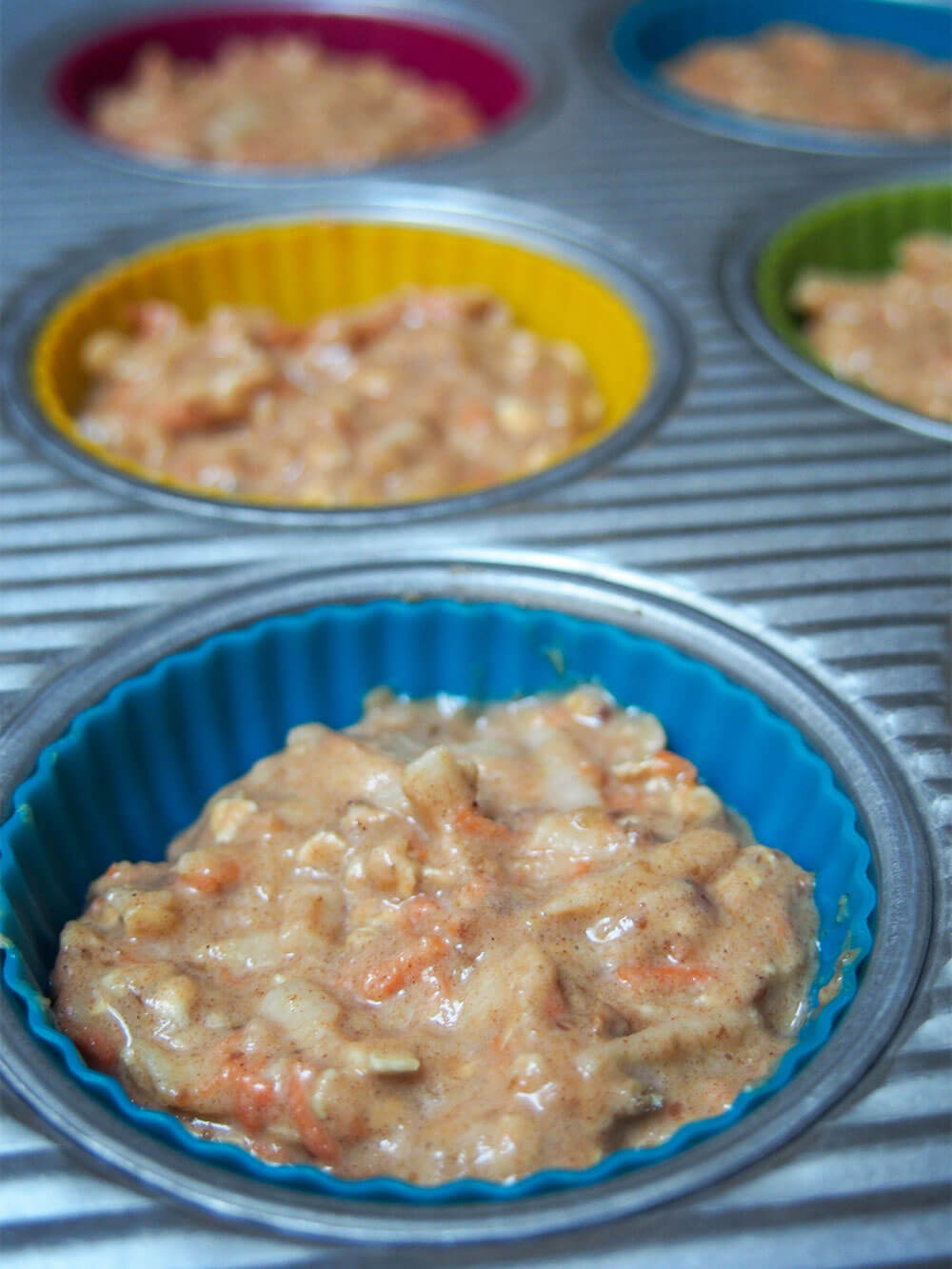 healthy carrot apple muffins ready to bake muffin batter in tin ready to bake