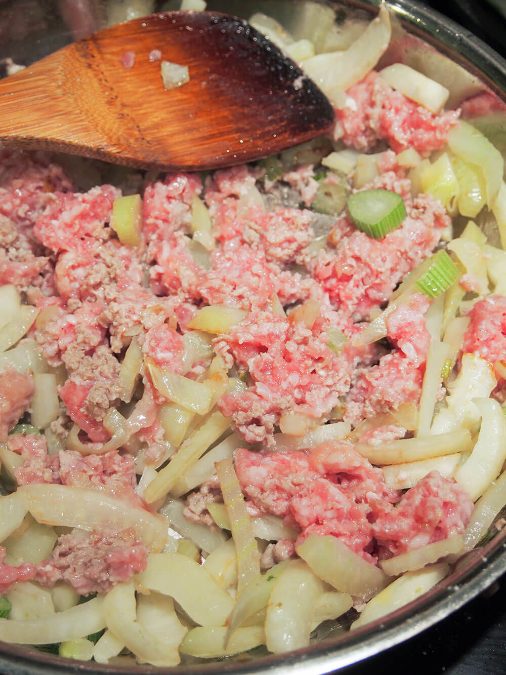 cooking fennel and ground pork in skillet