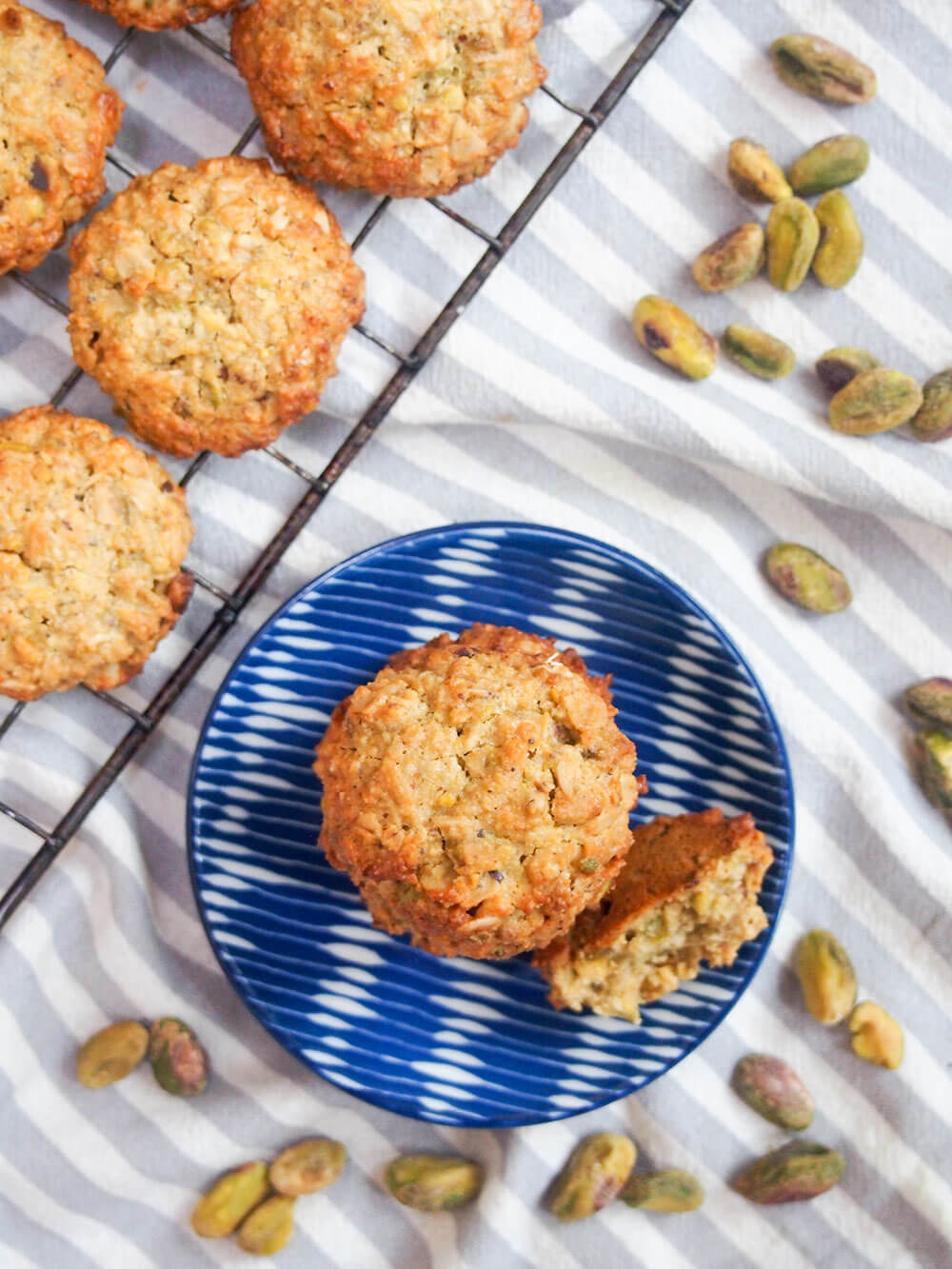 oatmeal pistachio cookies from overhead with some on small plate and others on cooling rack