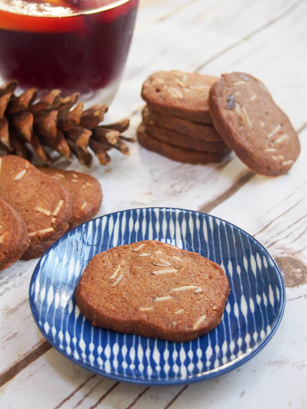 A cookie on small blue plate with another small stack behind