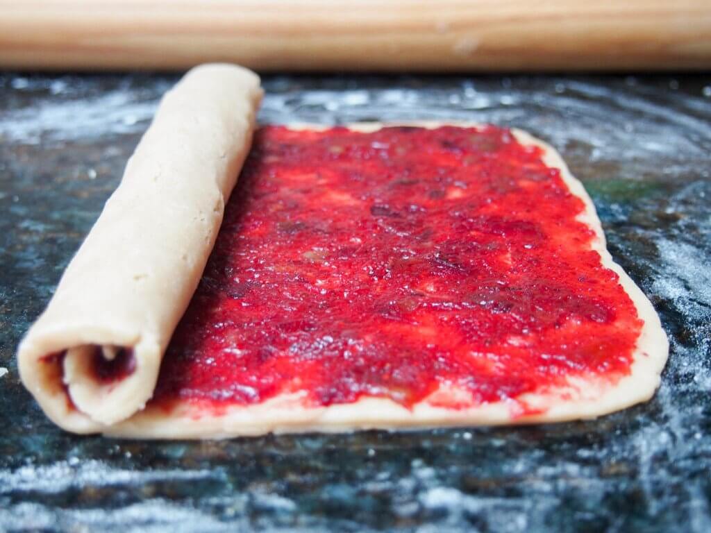 making Cranberry-pomegranate-filled shortbread spiral cookies