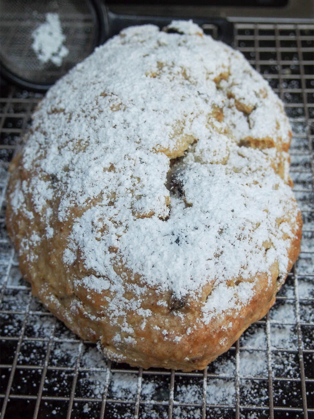 dusting stollen with powdered sugar