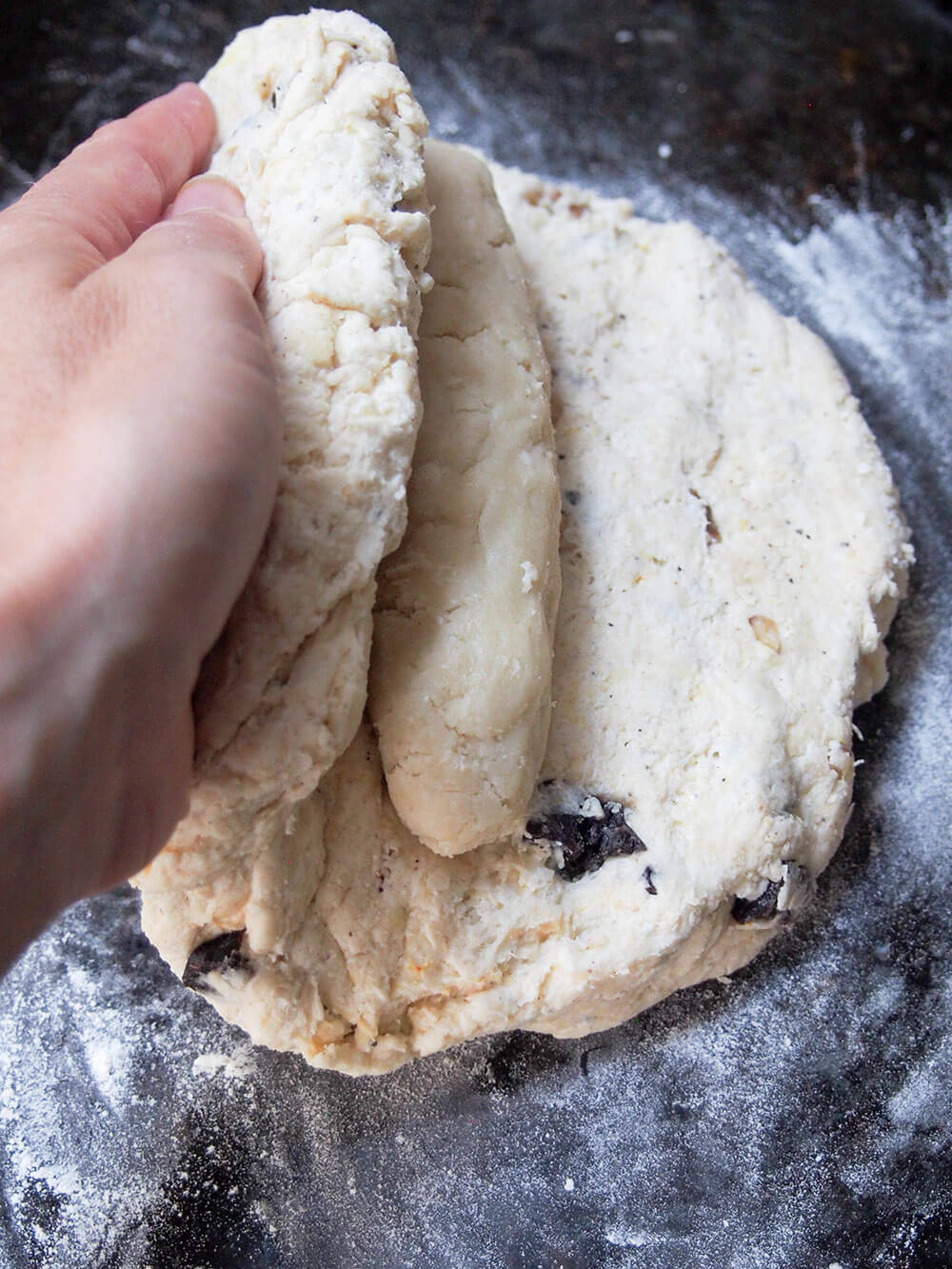 folding stollen dough over marzipan