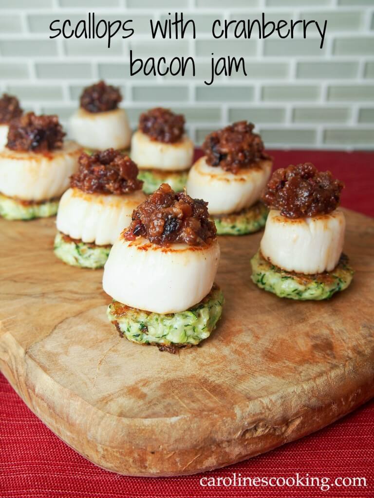 Scallops with cranberry bacon jam make for a stunning and delicious appetizer. Perfect for holiday entertaining or any excuse. via @carolinescookng