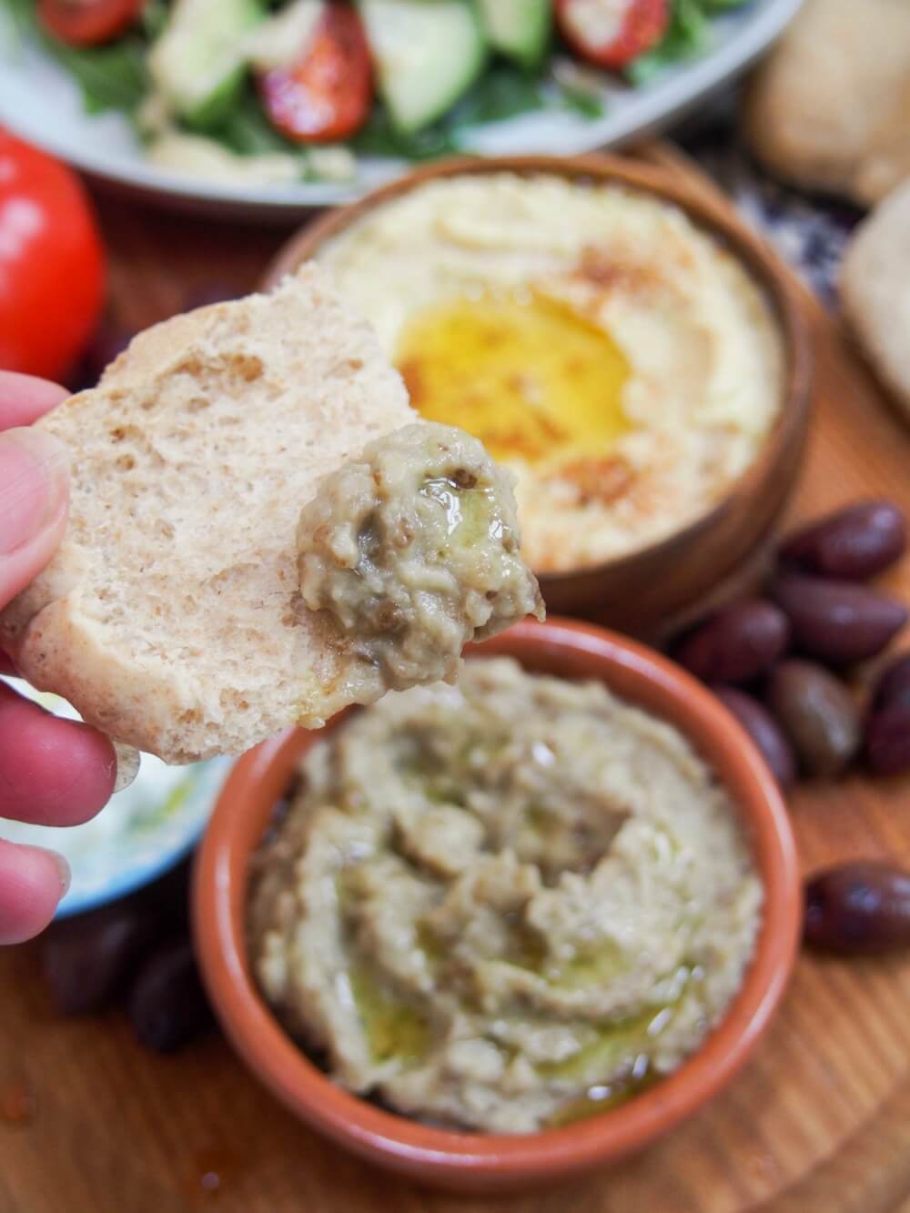 Baba ghanoush (or baba ganoush) is one of many dips/spread that's a staple on mezze plates. This eggplant dip tastes so creamy, but it's entirely vegan, and easy to make. Tasty and versatile. baba ghanoush eggplant dip/spread (baba ganoush) on pita bread
