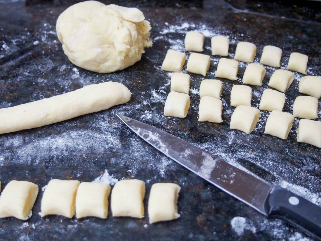 making gnocchi for Dessert gnocchi with balsamic strawberry sauce
