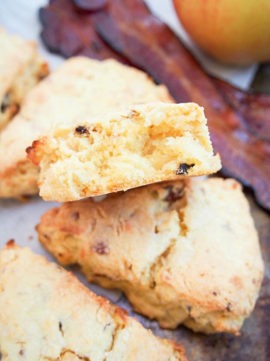 A broken scone resting on others below showing crumb inside