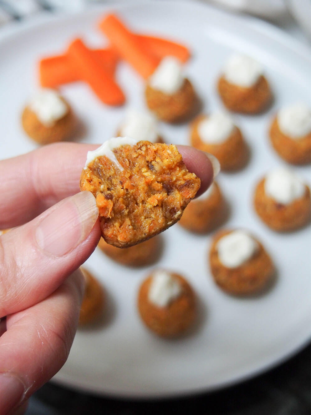 taking bite from carrot cake energy bites