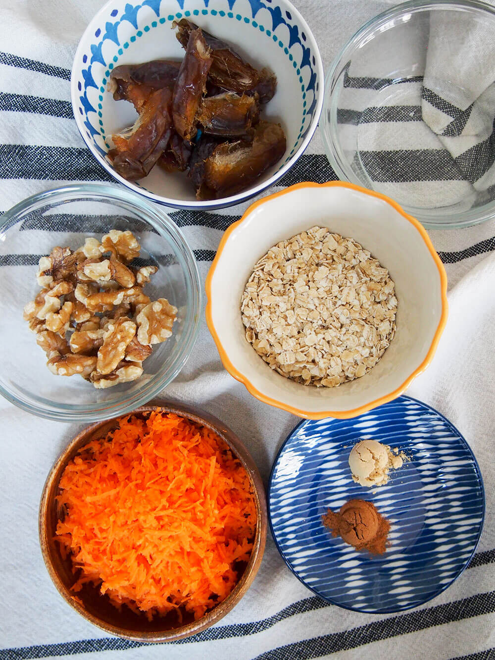 carrot cake energy bites ingredients in small bowls