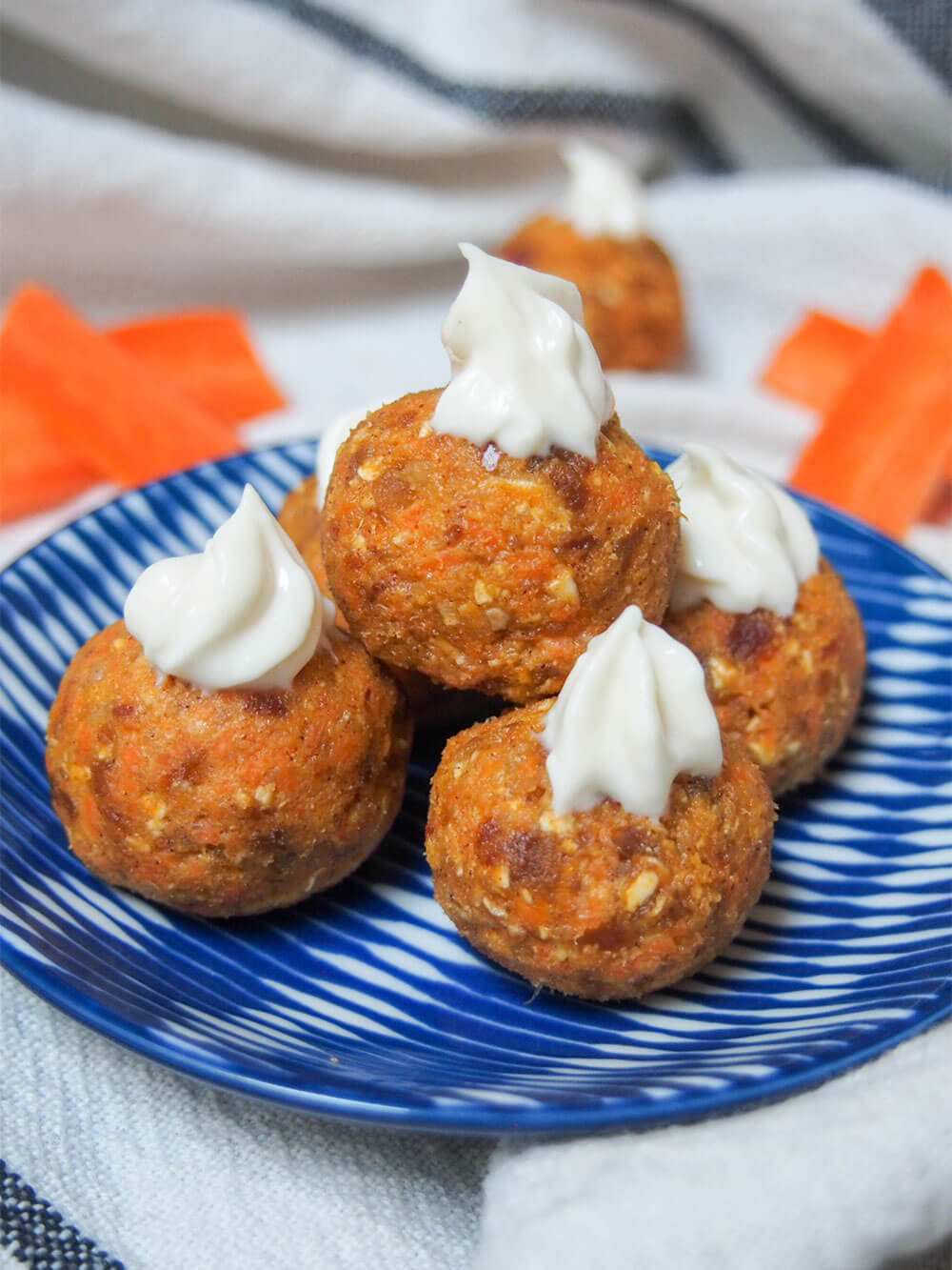 carrot cake energy bites stacked o small plate