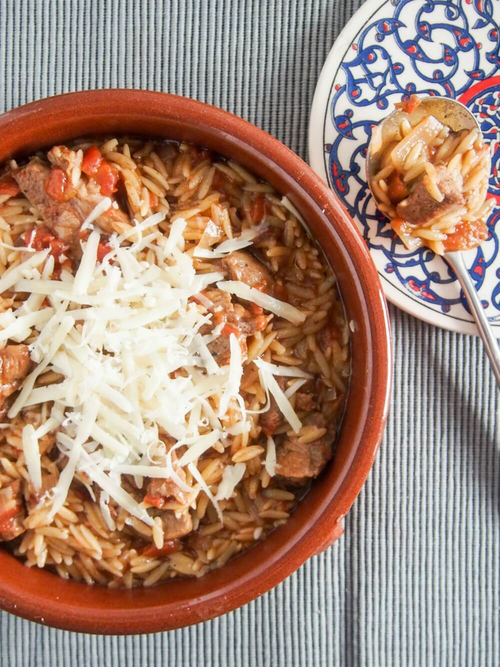Youvetsi is a delicious Greek stew made with beef or lamb and orzo cooked in a tasty tomato-based sauce. It's flavorful, comforting and easy to make too.
