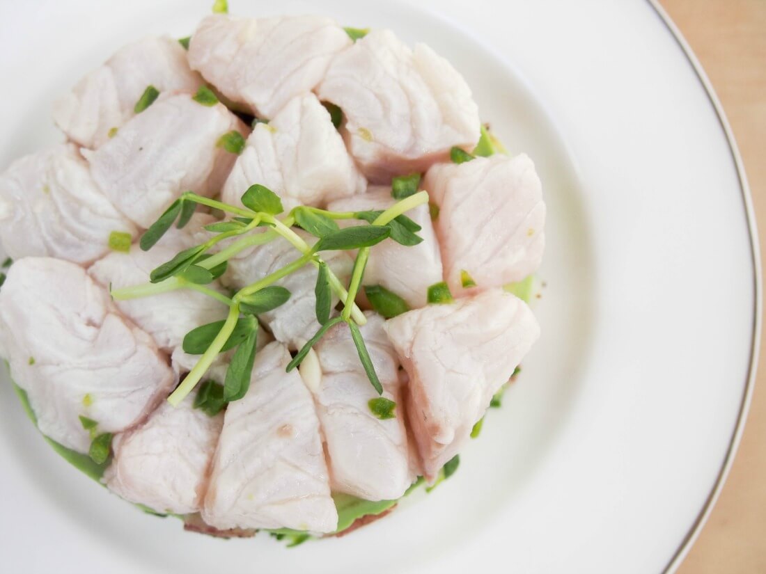 Ceviche with potato and pea shoot salad