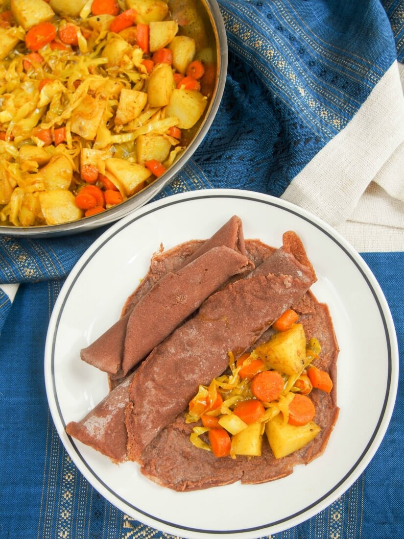 Ethiopian injera and tikel gomen - If you've yet to try Ethiopian food, you really should. Injera (flatbread) is the central to most meals & this tikel gomen (cabbage, carrots & potato) is a tasty, easy dish to serve with it. Gluten free and vegan