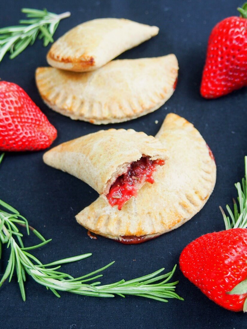 These strawberry empanadas have a fruit filling infused with rosemary, with optional chocolate chips for a delicious sweet treat that's relatively healthy.