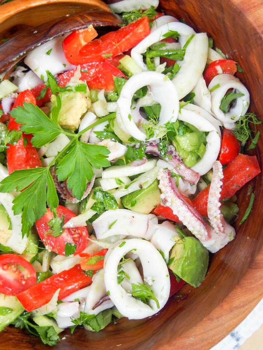 This calamari salad with fennel and avocado is a lovely mix of textures and flavors, all brought together with a citrus dressing. Perfect potluck side or appetizer.