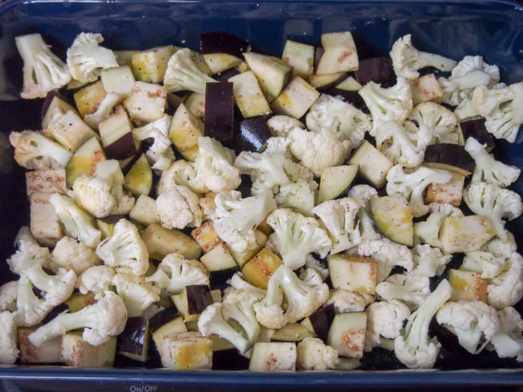 making roasted cauliflower and eggplant salad
